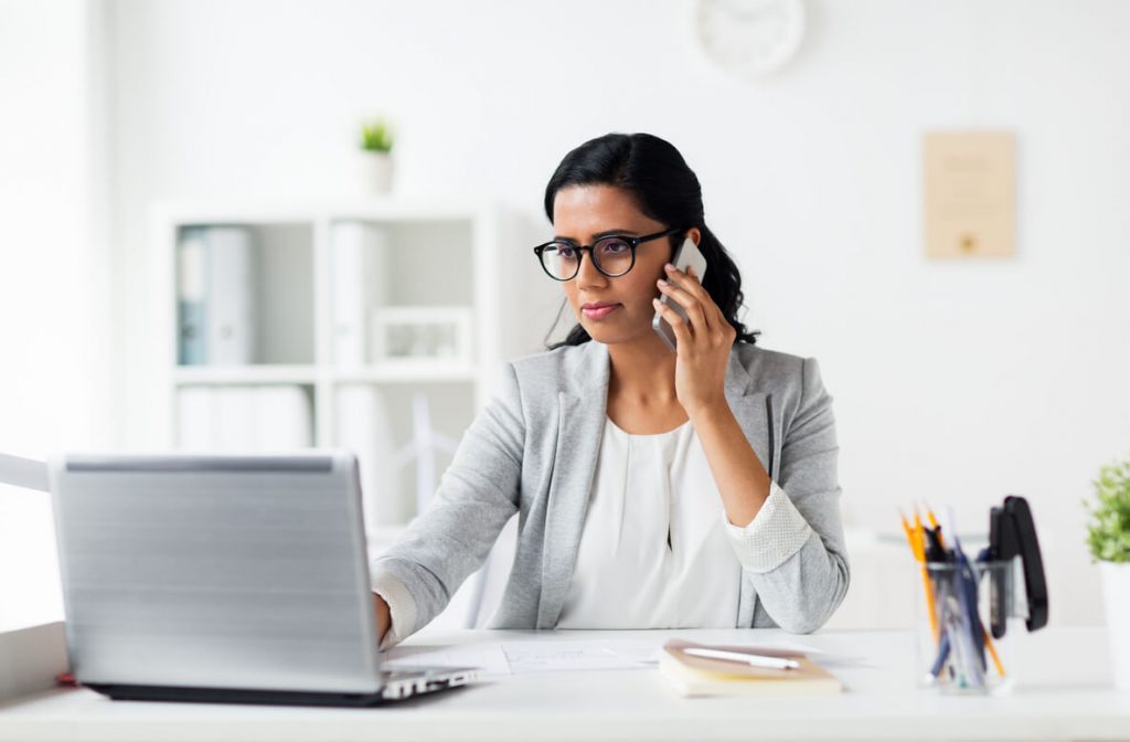 woman in front of laptop protecting sensitive personal information