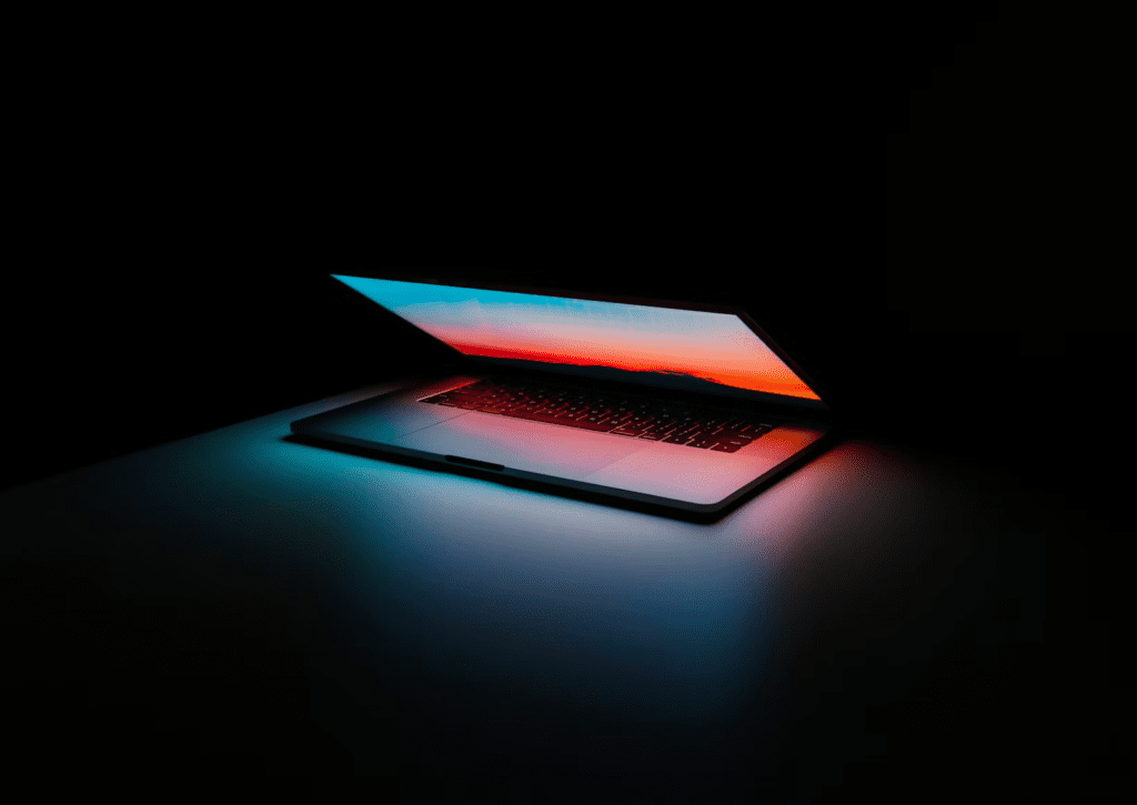 a laptop computer sitting on top of a table.