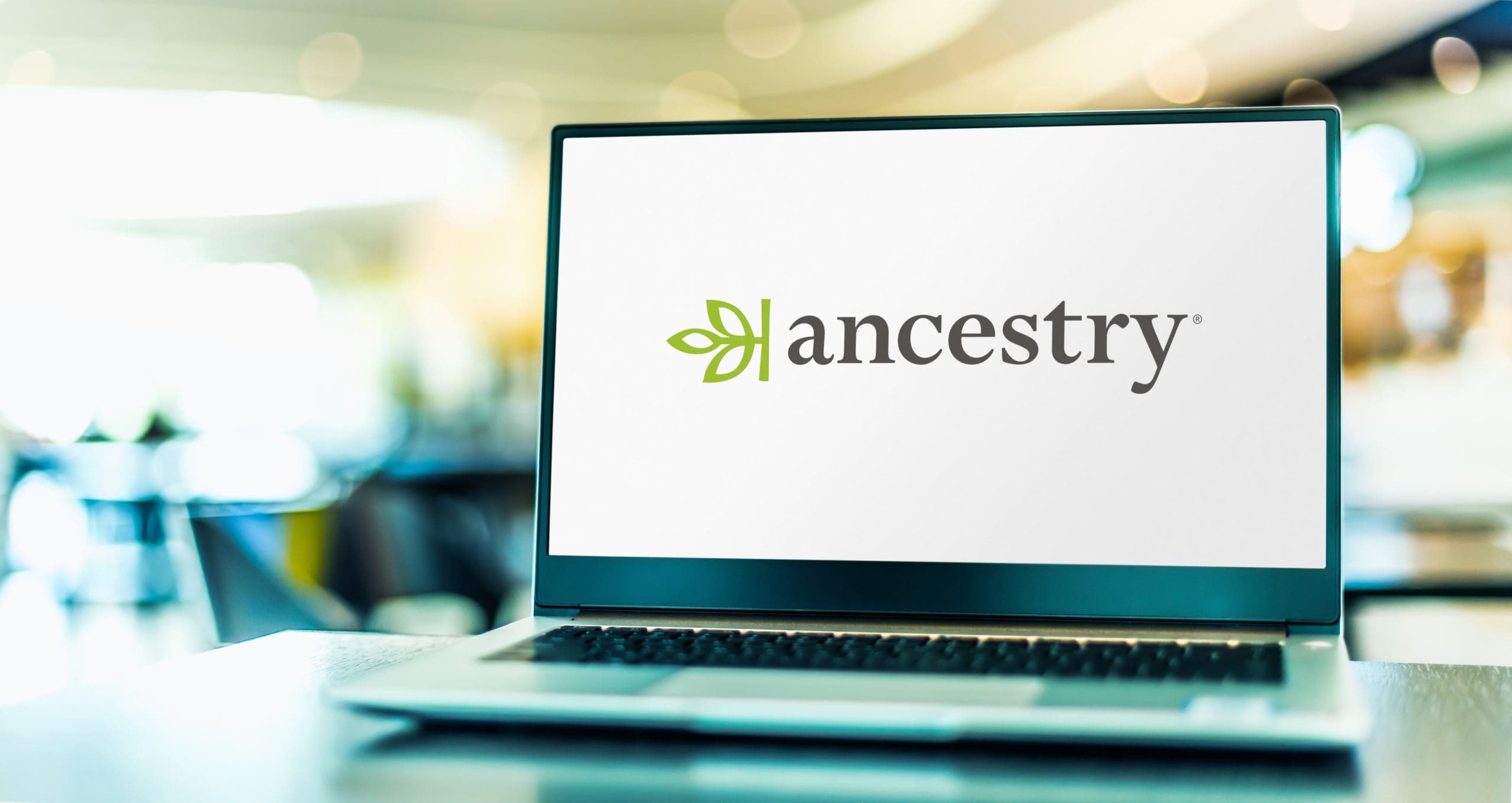 A laptop with the ancestry logo on it.