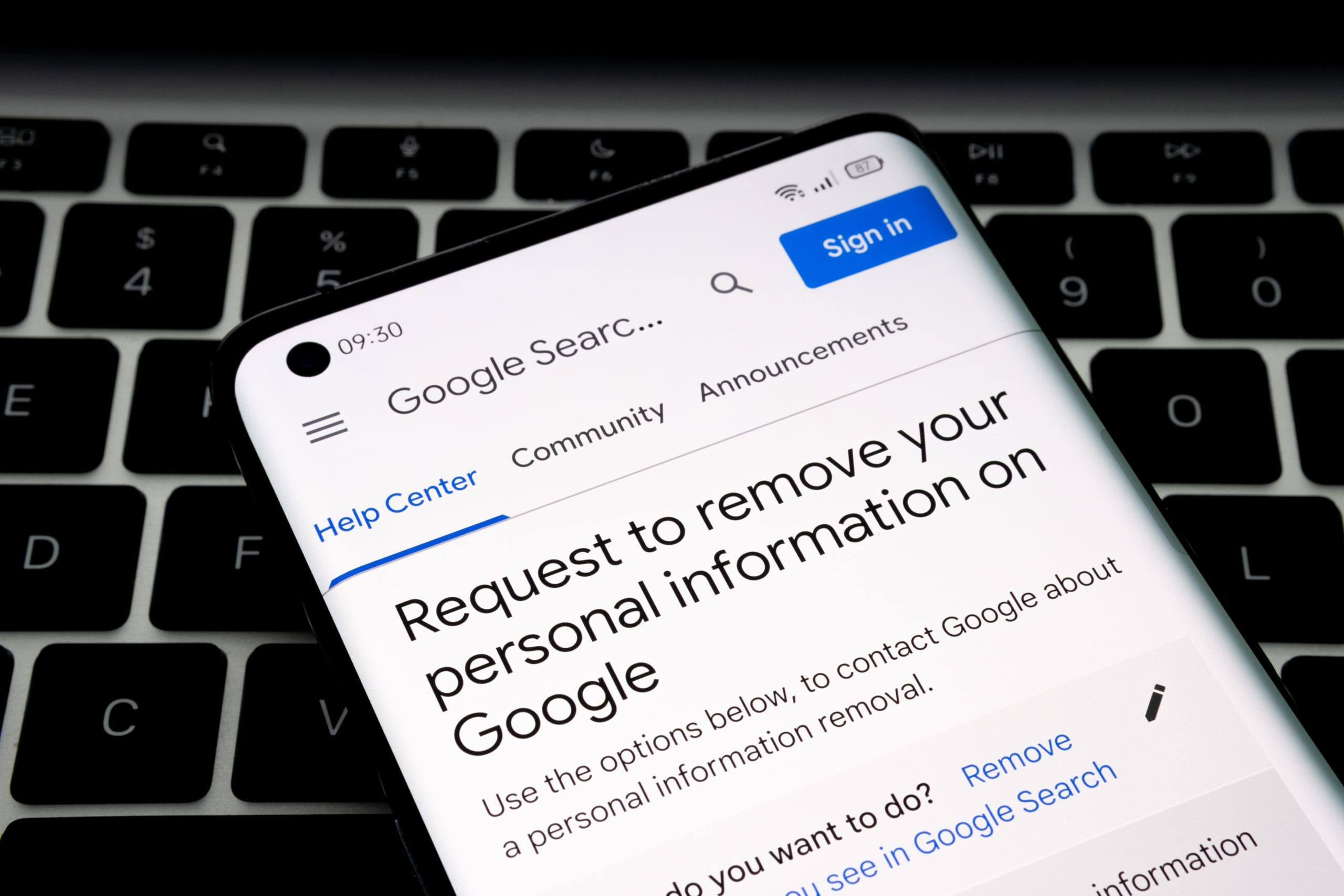 A phone is displaying the request to remove personal information on google search.